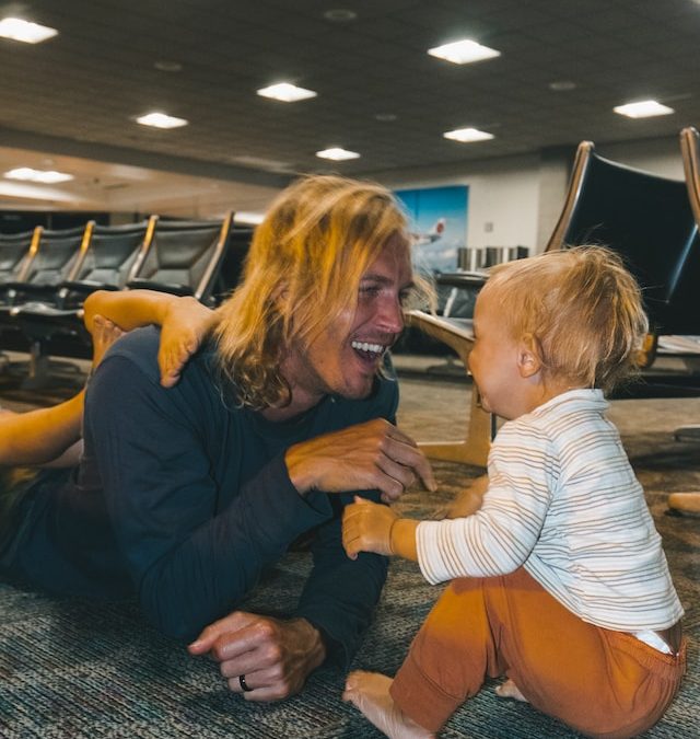 father and baby in airport